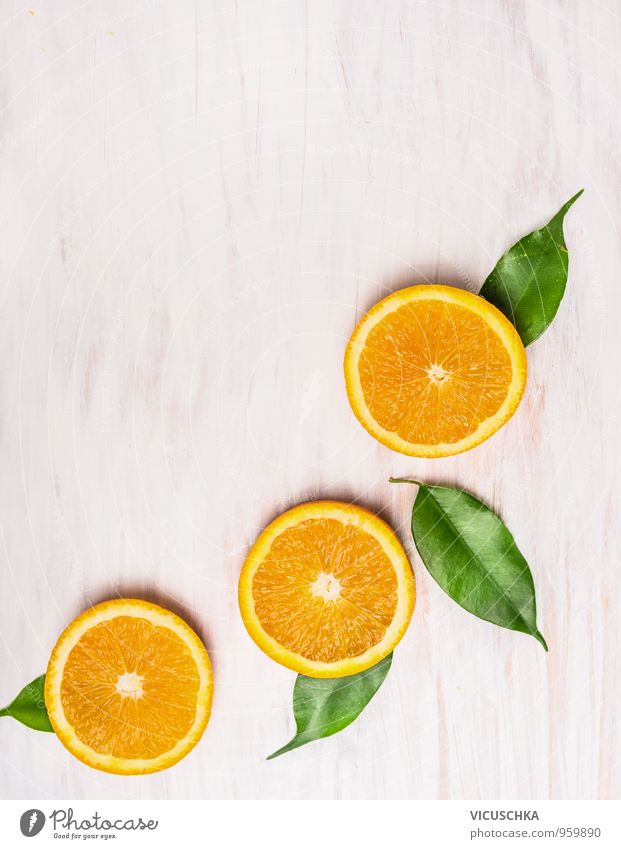 Cutting orange, fruits with leaves Food Fruit Orange Nutrition Breakfast Organic produce Vegetarian diet Diet Juice Style Design Summer Nature Yellow