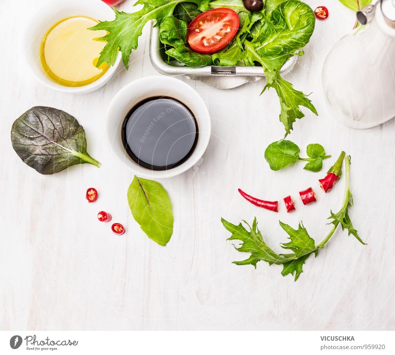 Salad preparation with oil and balsamico on a white wooden table Food Vegetable Lettuce Herbs and spices Cooking oil Nutrition Lunch Buffet Brunch