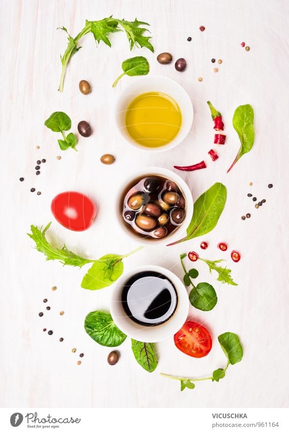 Salad preparation with dressings, olives, wild herbs, chilli, oil Food Vegetable Lettuce Herbs and spices Cooking oil Nutrition Lunch Dinner Buffet Brunch