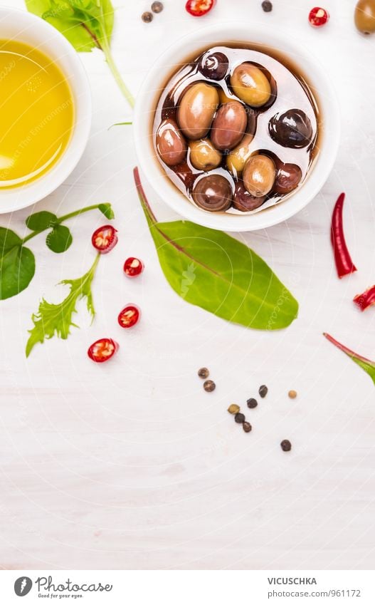 Olives in white bowl with spices and wild herbs Food Lettuce Salad Herbs and spices Lunch Organic produce Vegetarian diet Diet Bowl Design Nature