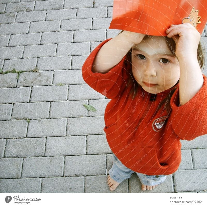 ...maybe it's still raining? ... Barefoot Child Toddler Girl Infancy Parenting Red Paper Cap Headwear Dirty Painted Boredom Street Feet Looking Snapshot