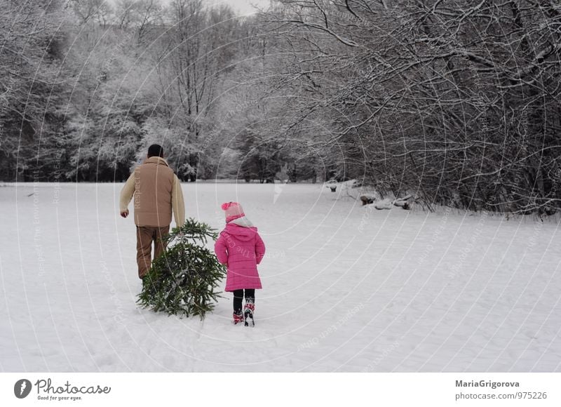 Taking Home a Christmas Tree Lifestyle Joy Winter Snow Winter vacation Mountain Christmas & Advent Human being Child Girl Man Adults Parents Father Body 2