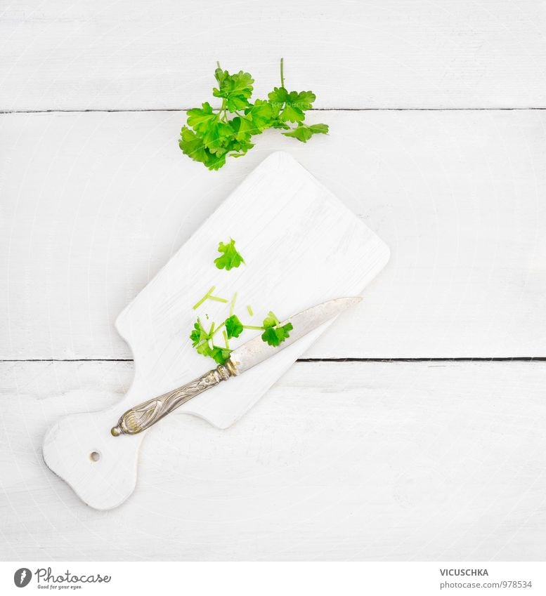 Parsley leaves on white chopping board Food Herbs and spices Nutrition Knives Lifestyle Style Design Healthy Eating Leisure and hobbies Chopping board Table