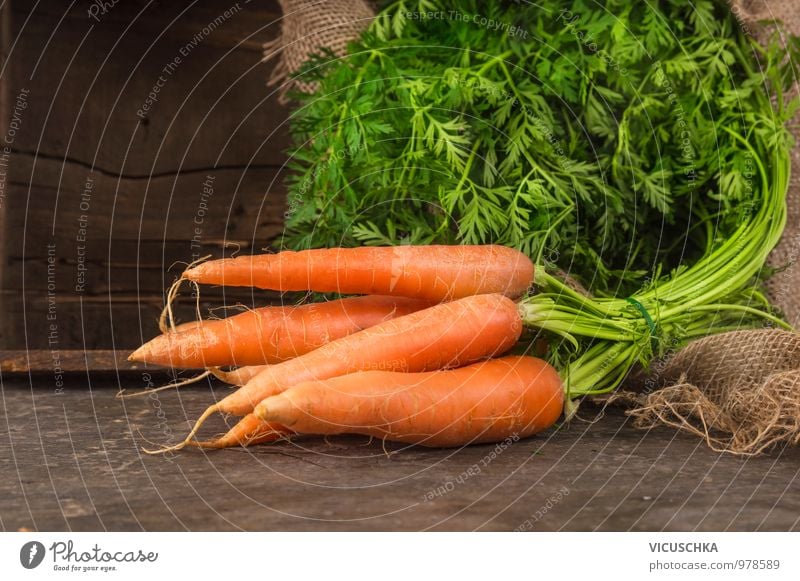 Carrot bunch Food Vegetable Nutrition Organic produce Vegetarian diet Diet Style Design Bundle Leaf Green Fresh Harvest Garden Wood Crate Sack Table Dark