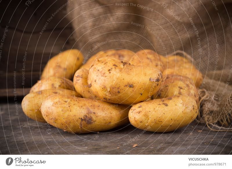 Fresh potatoes on a rustic wooden table Food Vegetable Nutrition Organic produce Vegetarian diet Diet Style Design Garden Sack Nature Potatoes Wooden table