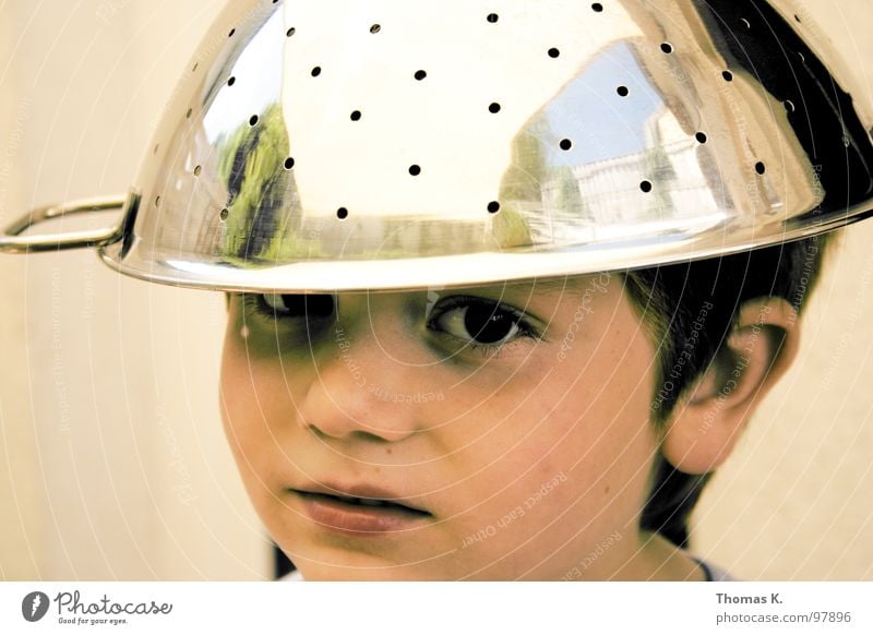 The apple... Portrait photograph Child Boy (child) Disbelief Helmet Mistrust Humor Electronic Magnetic Chrome Carry handle UFO Joy Communicate Looking Hat