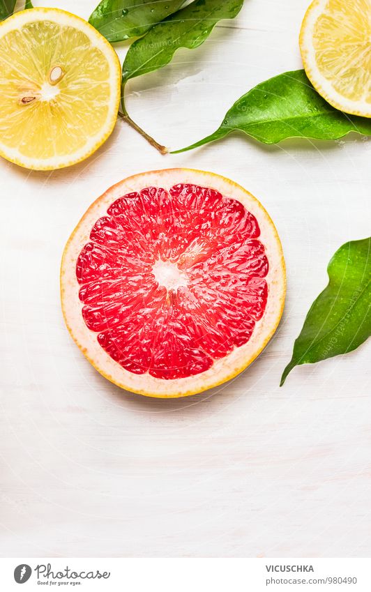 Grapefruit slice with leaves and citrus fruits Food Fruit Orange Nutrition Juice Style Design Healthy Eating Life Nature Yellow Pink Background picture Snack