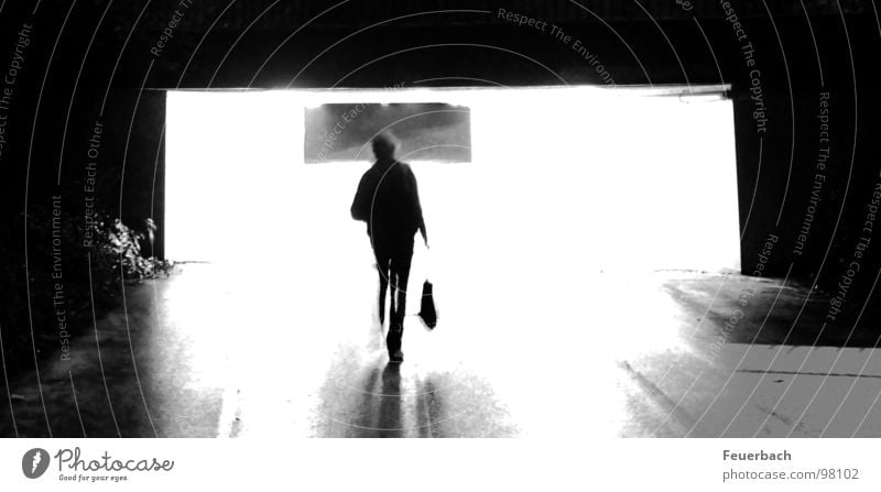 At the end of the tunnel... it'll get dark again. Black & white photo Exterior shot Light Shadow Contrast Back-light Long exposure Human being Rain Tunnel