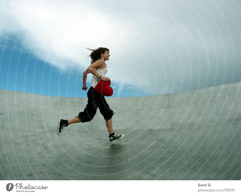 You stole my heart. Woman Young woman Touch Bad weather Clouds Location Footwear Chucks Gray Red Flexible Long-haired Wind Symbols and metaphors Cushion Heart