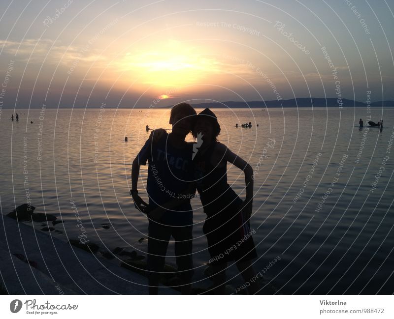 Sunset at Lake Balaton Child Brothers and sisters Friendship Couple Youth (Young adults) 2 Human being 13 - 18 years Nature Water Sunrise Sunlight Summer