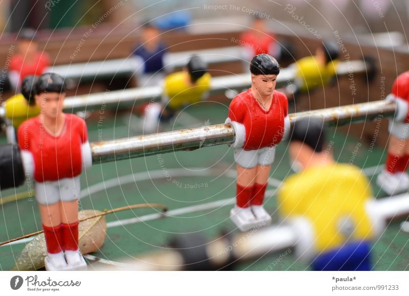 Red vs Yellow Athletic Leisure and hobbies Playing Table soccer Sports Old Dirty Blue Green Colour photo Multicoloured Exterior shot Close-up Detail Day