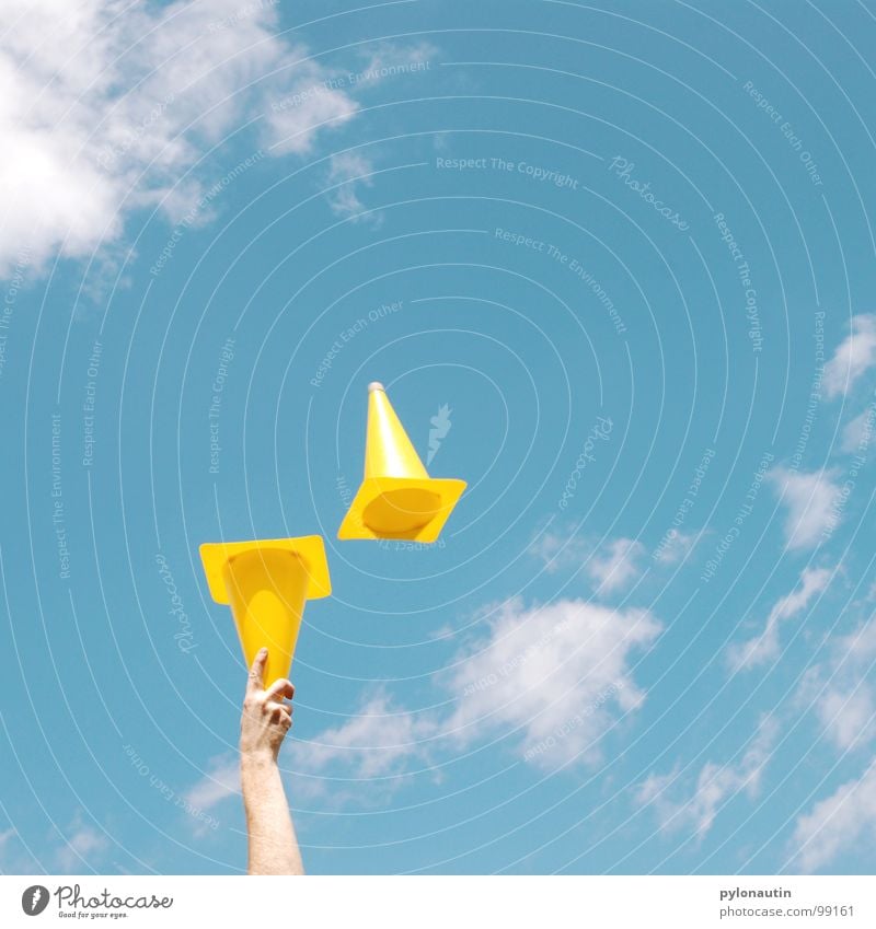 Pylons in the sky Yellow Clouds Hand Juggle Playing Traffic cone Sky Blue Arm Flying Plastic