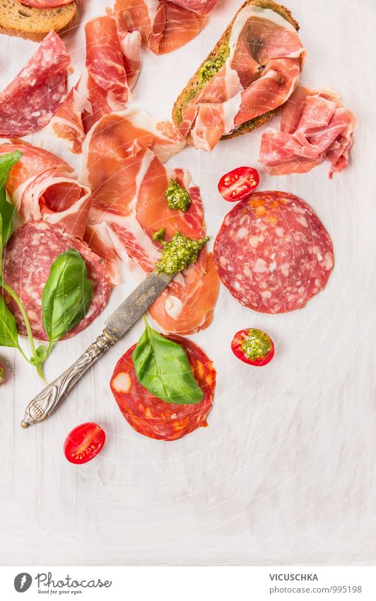 Bruschetta with Italian sausage, ham and pesto Food Sausage Vegetable Nutrition Breakfast Lunch Knives Style Design Italian Food Italien pesto Basil Tomato Ham