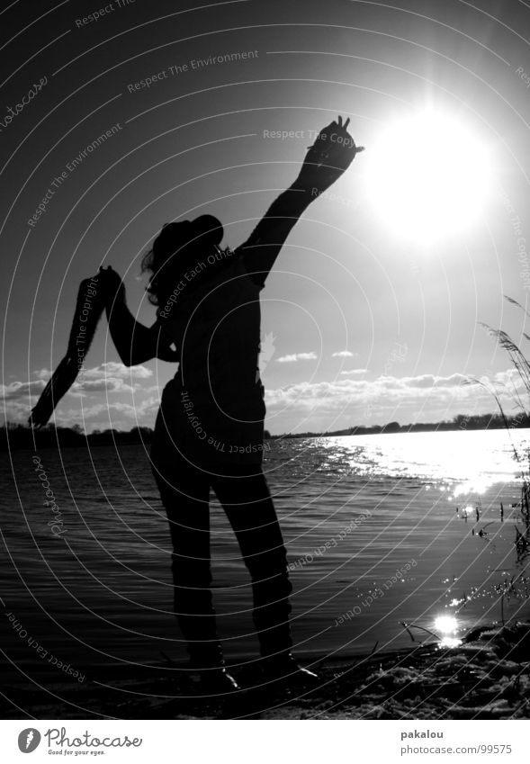 catch a part of the sky Catch Dark Back-light Woman Human being Lake Horizon Longing Scarf Reflection Black & white photo Autumn Shadow silouette Nature Water