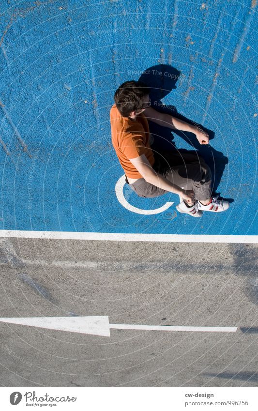 Man on Ball Human being Masculine Young man Youth (Young adults) Adults Life 1 Pedestrian Lanes & trails Sidewalk Footpath Stone Concrete Sign