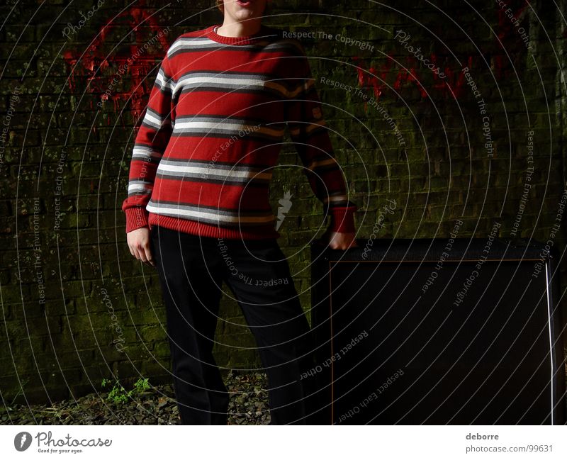 Boy standing next to a guitar amp in a derelict railway tunnel. Striped Cave Tunnel Red Black Dark Loudspeaker Intensifier Sweater Fellow Youth (Young adults)