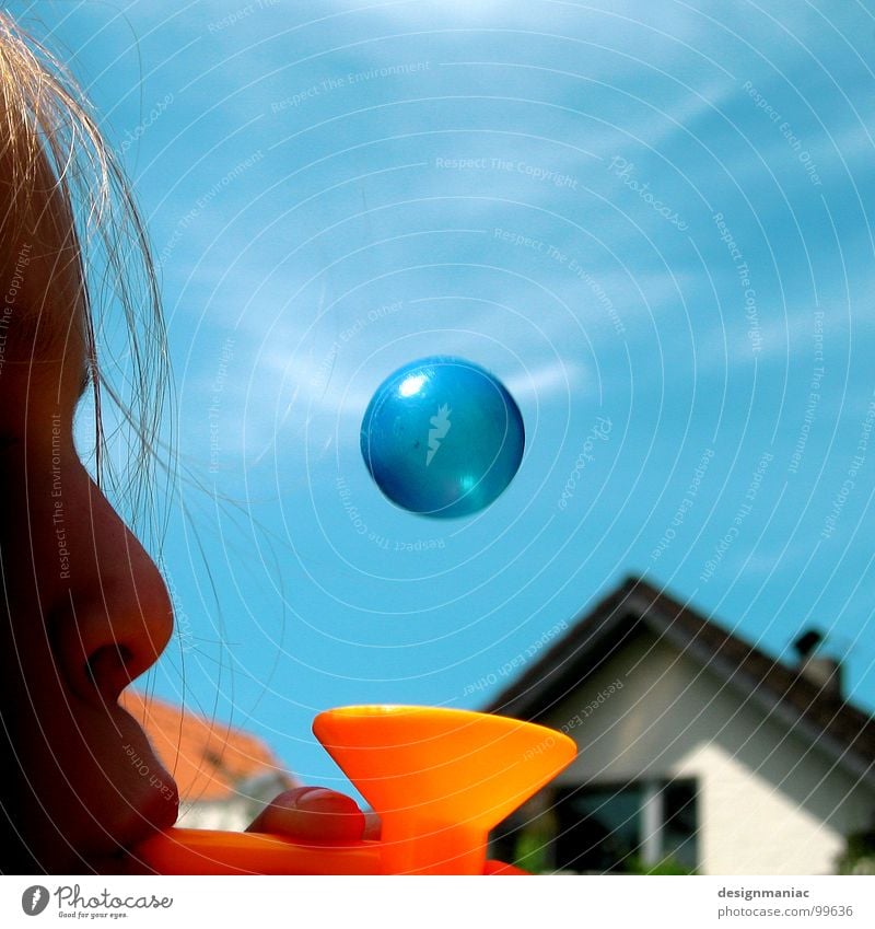 What's round, small and blue? Child Girl House (Residential Structure) Clouds Round Middle Blow Blonde Planet Window Roof Magic Weightlessness Funnel Playing