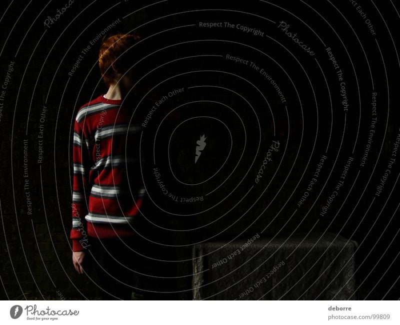 Boy standing in a dark tunnel with half his body in the shadow. Dark Tunnel Things Red Red-haired Striped Mysterious Crate Youth (Young adults) Shadow wnad